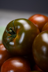 Fresh ripe sweet reddish brown and green kumato tomatoes