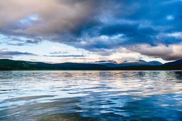 Spectacular view of a mountain lake at sunset in Ulagansky district of the Altai Republic, Russia