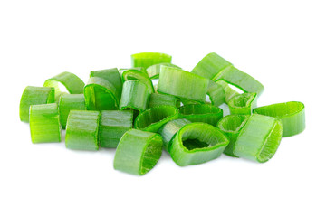 Heap of chopped spring onions isolated on white background. Sliced green onions on a white background, front view. Fresh chopped green onions on a white background, close-up. Pieces of green onions.