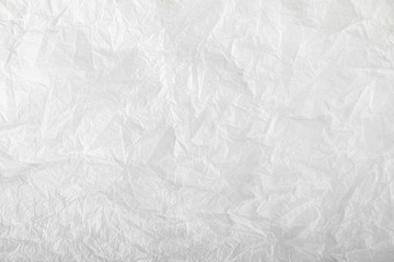 White crumpled paper texture background. Clean white crumpled paper. Flat lay, top view, copy space