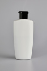 A pack shot of shampoo, soap bottle in isolated grey background.