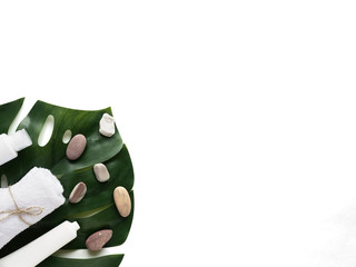 Сare product cream, towel, bath accessories on white background, top view, copyspace. Bodycare and beauty treatments concept, eco organic bath products, daily routine, stone therapy