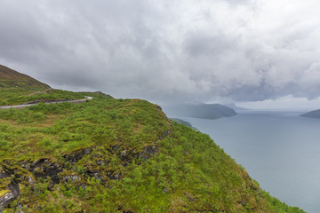 End of fjord. Beautiful Norwegian landscape. view of the fjords. Norway ideal fjord reflection in clear water In cloudy weather. selective focus