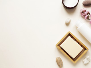 care products lotion, plant, soap, stone. bath accessories on bright background, top view, copyspace. Bodycare beauty treatments at home concept, organic products, morning routine