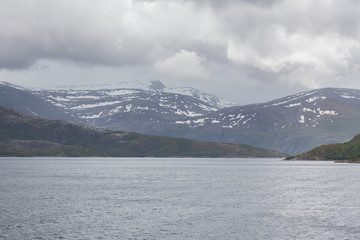 End of fjord. Beautiful Norwegian landscape. view of the fjords. Norway ideal fjord reflection in clear water In cloudy weather. selective focus