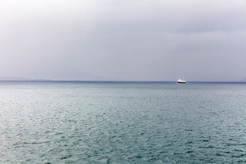 Beautiful view of the Norwegian fjords with turquoise water surrounded by cloudy sky, selective focus