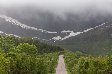road passing in a valley between mountains in Norway, selective focus
