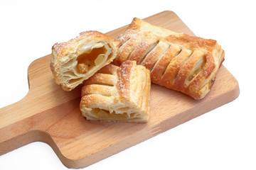 ITALIAN CRISPY DESSERT PASTRY ON A WOODEN CUTTING BOARD
