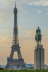Fototapeta na wymiar Paris, France - 04 25 2020: View of the Eiffel Tower from the place of the trocadero and the equestrian statue of Marshal Foch during the coronavirus period
