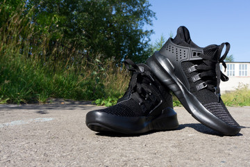 black running shoes isolate on the production of