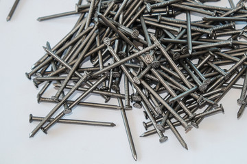Pile of nails on white isolated background
