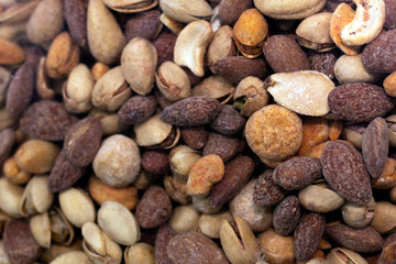 Different nuts background. Selective focus in perspective