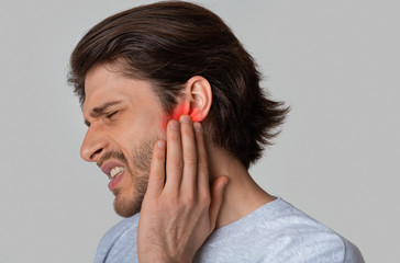 Highlighted in red pain in mans ear