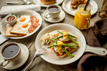 Breakfast with coffee toast with egg juice daylight cafe restaurant towel american wooden table