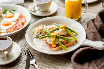 Breakfast with coffee toast with egg juice daylight cafe restaurant towel american wooden table