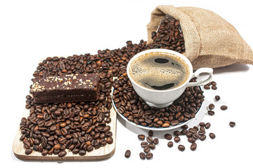 Coffee cups and coffee beans and chocolate bread on a white background