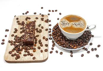 Coffee cups and coffee beans and chocolate bread on a white background