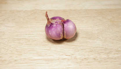 Shallot, separate on a white background, fresh shallots on a wooden background