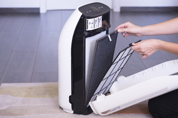 Changing or cleaning the air purifier HEPA filter after using for a long time