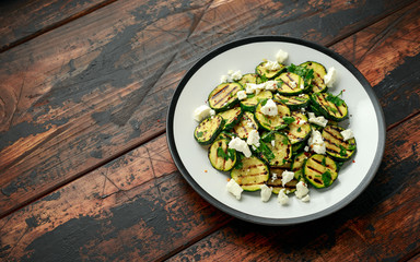 Warm salad with grilled zucchini, garlic and herbs