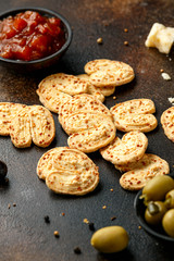 Cheese Palmiers with garlic, parmesan, grape, olives and chutney. party food snacks