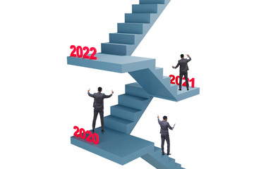 Businessman climbing stairs on yearly basis