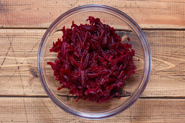 Step-by-step preparation of summer cold soup with beets and kefir, step 2 - grated boiled beets, top view, top view, selective focus