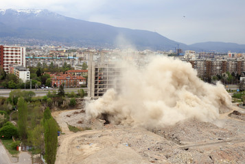 Controlled explosion with blasts of a unfinished and abandoned empty high building, printing press house IPK Rodina, in Sofia, Bulgaria on 04/26/2020.