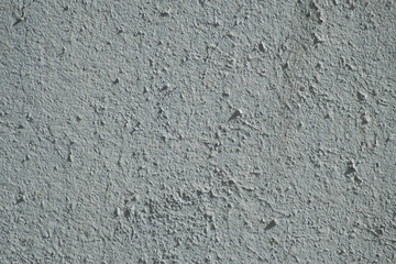 The texture of an old wall painted in pale blue