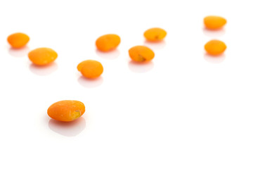 Grains lentils organic seeds isolated on white. Pile healthy orange pea background. Clean-eating food with antioxidant, omega-3, protein and copy space.