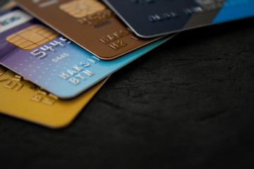 Macro shot of colorful credit cards on brown leather background