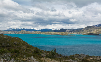 Nordenskjold lake view, with snowy mountais in the back.