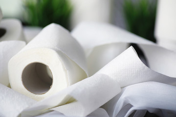 Toilet paper in a roll. Snow-white soft three-layer toilet paper. Lack of hygiene products. Primary protection and disinfection.