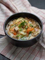 The noodle soup in a Japanese black bowl