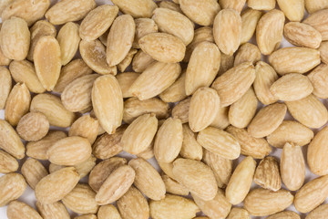 background of salted roasted almonds for a healthy snack