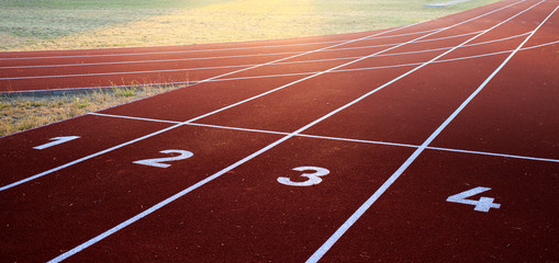 Starting position on a professional athletic track during sunset as a great opportunity