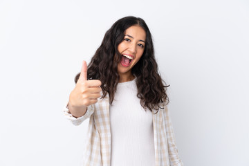Mixed race woman over isolated white background with thumbs up because something good has happened