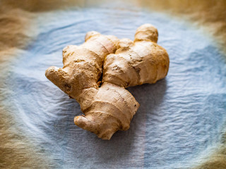 Piece of ginger on white paper
