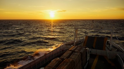 Summer sunset over the sea from ferry