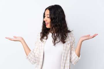 Mixed race woman over isolated white background holding copyspace with two hands