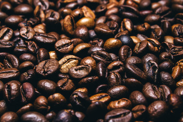 Roasted coffee beans on black background