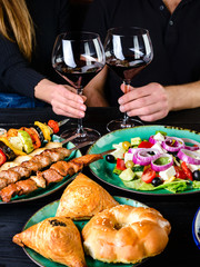 romantic dinner in a restaurant with wine, barbecue and salad