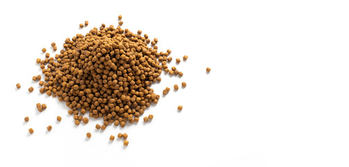 Above or Top view of animal food. Brown Dried dog food on white background. Grain pet food banner background with copy space for text design.