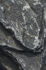 Texture of raw stone, marble in natural light. Rough natural background.