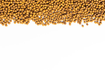 Above or Top view of animal food. Brown Dried dog food on white background. Grain pet food banner...