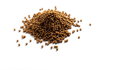 Above or Top view of animal food. Brown Dried dog food on white background. Grain pet food banner background with copy space for text design.