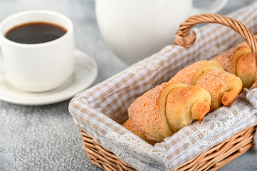 Sweet homemade cottage cheese buns with sugar and coffee cup