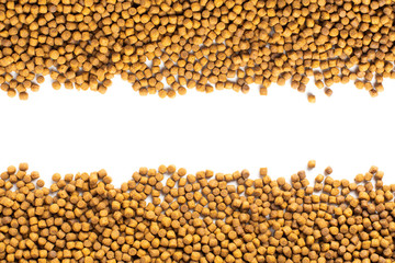 Above or Top view of animal food. Brown Dried dog food on white background. Grain pet food banner background with copy space for text design.