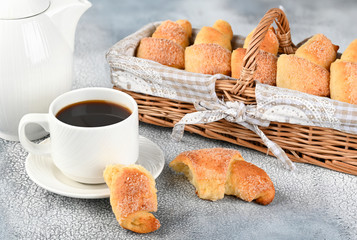 Sweet homemade cottage cheese buns with sugar and coffee cup