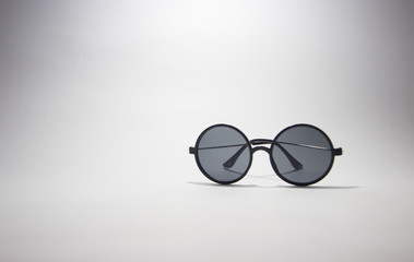 Circular sunglasses on a white background